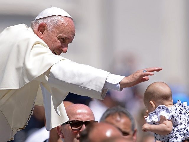 Pope Francis blesses a baby during his weekly general audience at St Peter's square on June 10, 2015 at the Vatican. AFP PHOTO / FILIPPO MONTEFORTE (Photo credit should read FILIPPO MONTEFORTE/AFP/Getty Images)