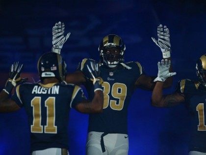 Tavon Austin #11, Jared Cook #89, Chris Givens #13 of the St. Louis Rams pay homage to Mike Brown by holding their hands up during their pre-game introduction against the Oakland Raiders at the Edward Jones Dome on November 30, 2014 in St. Louis, Missouri. The Rams beat the Raiders …