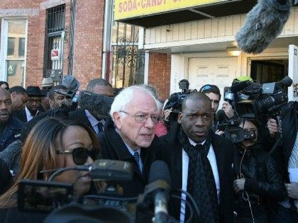 Democratic presidential candidate Sen. Bernie Sanders, (I-VT) is given a tour of Sandtown-