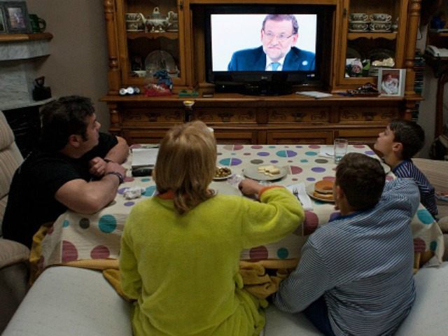 family watches TV Getty