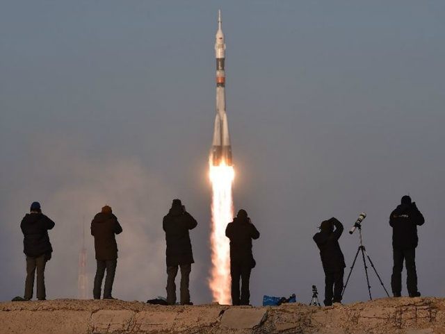 Russia's Soyuz TMA-19M spacecraft blasts off carrying Britain's astronaut Tim &h