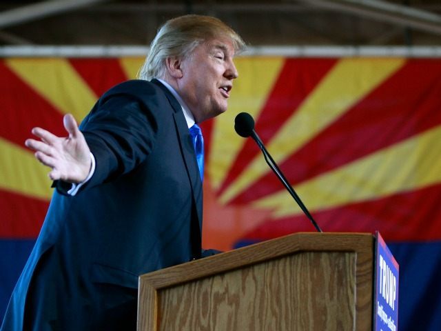 Republican presidential candidate Donald Trump speaks to guest gathered during a campaign event at the International Air Response facility on December 16, 2015 in Mesa, Arizona. Trump is in Arizona the day after the Republican Presidential Debate hosted by CNN in Las Vegas, Nevada. (Photo by Ralph Freso/Getty Images)