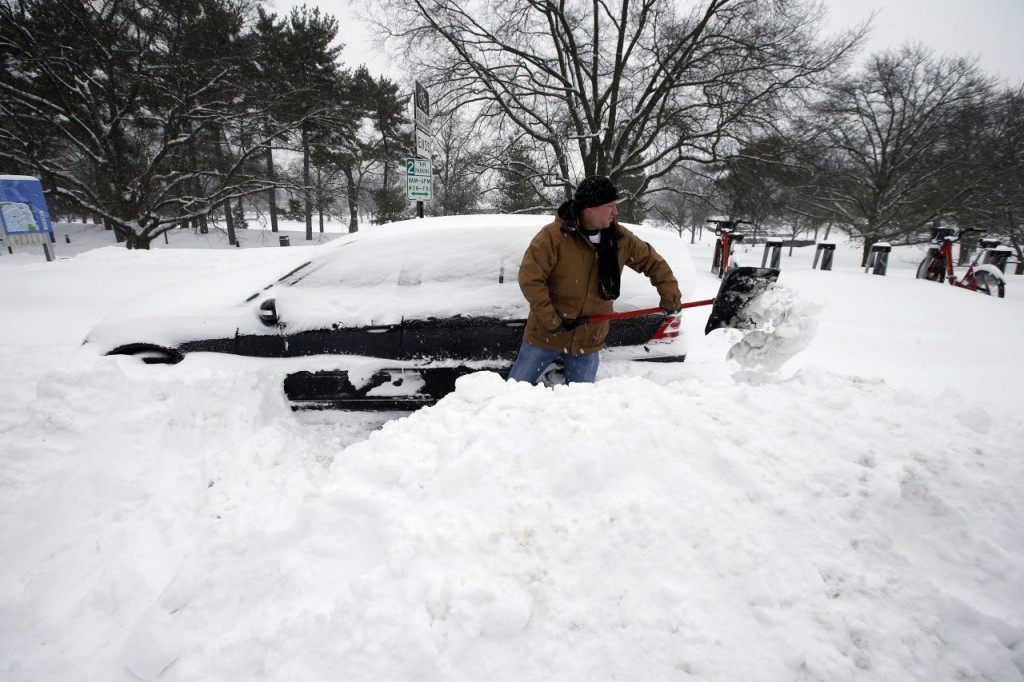 Jared Meyer of Chattanooga, Tenn., digs out his car from the snow on Saturday in Arlington, VA. (AP Photo/Alex Brandon)