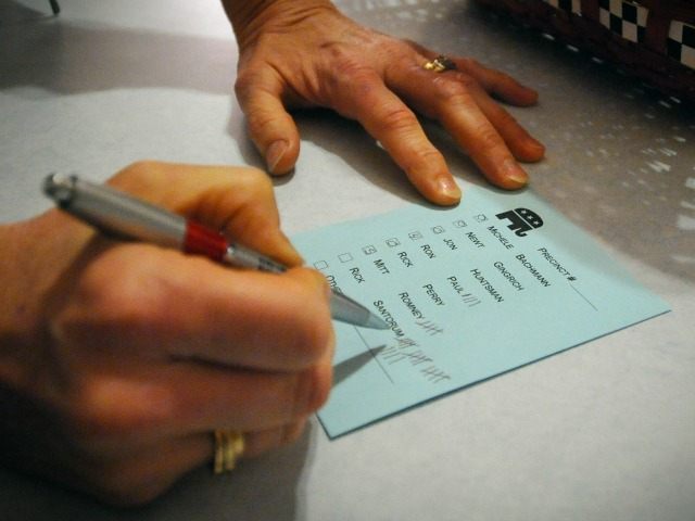 Barb Hansen tallies votes during a caucus of precinct 42 near Smithland, Iowa Tuesday, Jan