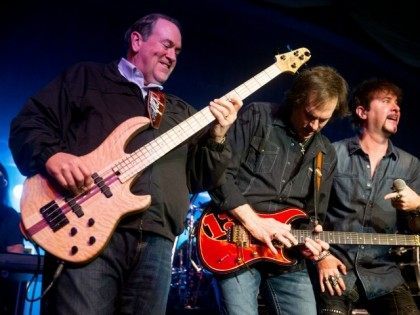 Republican presidential candidate former Arkansas Gov. Mike Huckabee, left, plays bass guitar as he performs with the 80's rock band FireHouse at the Surf Ballroom in Clear Lake, Iowa, Friday, Jan. 22, 2016. In 2008, Huckabee performed at the ballroom, made famous for being the last venue Buddy Holly played …
