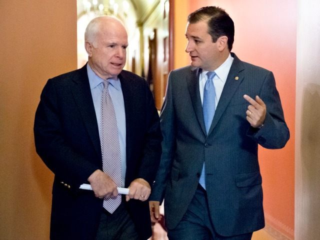 Sen. John McCain, R-Ariz., left, and Sen. Ted Cruz, R-Texas, right, confer at the Capitol in Washington, Oct. 12, 2013.