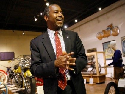 Republican presidential candidate Dr. Ben Carson walks through the National Motorcycle Museum in Anamosa, Iowa, Thursday, Jan. 7, 2016, after holding a town hall.