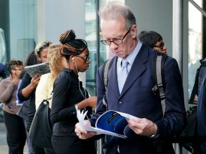Job hunters line up for interviews at an employment fair sponsored by the New York State D