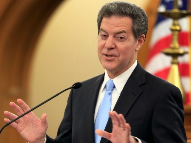 Kansas Gov. Sam Brownback delivers his State of the State address to a joint session of the legislature in Topeka, Kan., Tuesday, Jan. 12, 2016.