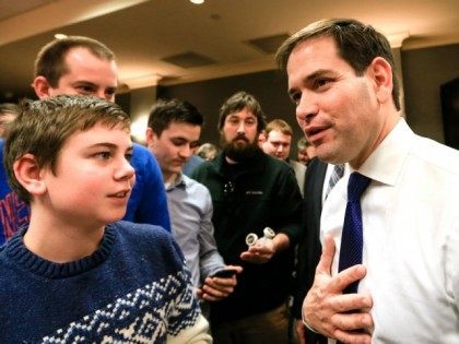 Republican presidential candidate, Sen. Marco Rubio, R-Fla., right, talks to members of th