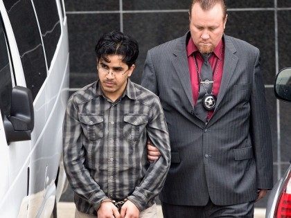 Omar Faraj Saeed Al Hardan, left, is escorted by U.S. Marshals from the Bob Casey Federal Courthouse on Friday, Jan. 8, 2016, in Houston. Al Hardan made his initial appearance in federal court in Houston Friday morning after he was indicted Wednesday on three charges related to accusations he tried …