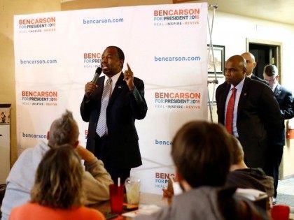 Republican presidential candidate Dr. Ben Carson, center, speaks during a town hall at Adams Street Espresso and Soda Shoppe in Creston, Iowa, Friday, Jan. 22, 2016.