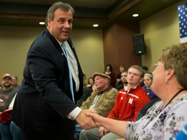 Republican presidential candidate, New Jersey Gov. Chris Christie shakes hands with suppor