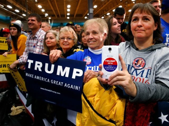 Supporters listen to Republican presidential candidate Donald Trump speak during a campaig