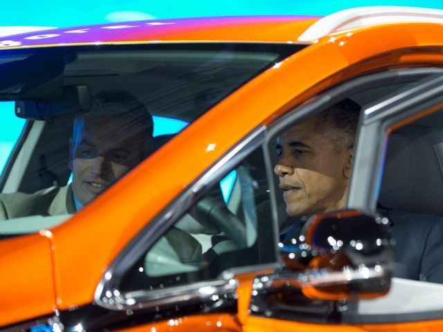 President Barack Obama sits in a new Chevrolet Bolt electric car with Patrick Foley, controls manager for the Bolt EV at GM in Detroit, as he visits the 2016 North American International Auto Show in Detroit, Wednesday, Jan. 20, 2016, to highlight the progress made by the American auto industry. …