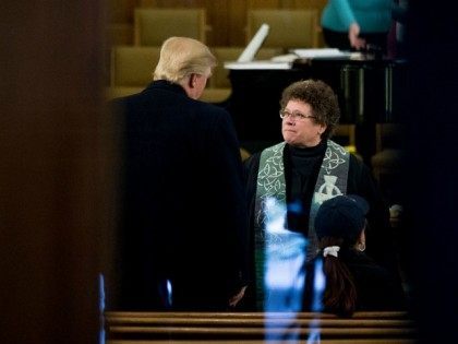 Republican presidential candidate Donald Trump speaks with Rev. Dr. Pamela Saturnia as he