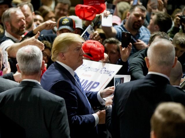 Republican presidential candidate Donald Trump greets members of the audience after speaki