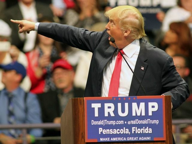 Republican presidential candidate Donald Trump points to the audience as he speaks during