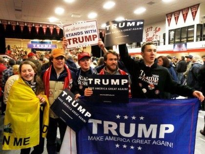 Supporters of Republican presidential candidate Donald Trump cheer as Trump gets ready to speak to a crowd Tuesday, Jan. 5, 2016, in Claremont, N.H.