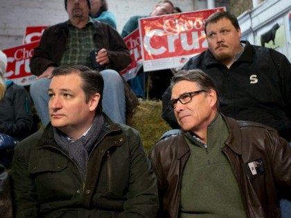 Republican presidential candidate, Sen. Ted Cruz, R-Texas sits with former Texas Gov. Rick
