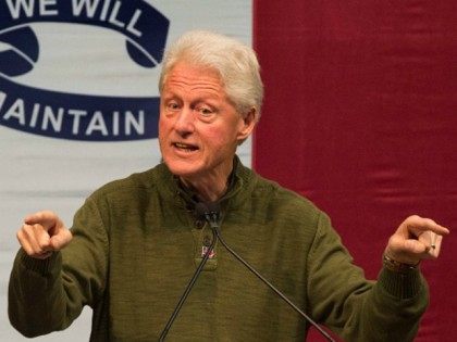 Former US President Bill Clinton speaks during a campaign rally for his wife, Democratic p