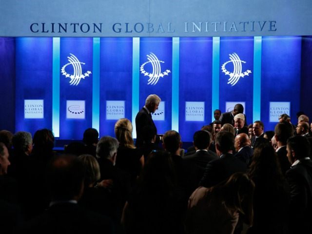 Former U.S. President walks off stage at the conclusion of the Clinton Global Initiative 2