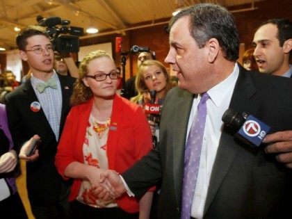 Republican presidential candidate, New Jersey Gov. Chris Christie shakes hands with students during a campaign stop at a college student convention, Tuesday, Jan. 5, 2016, in Manchester, N.H.