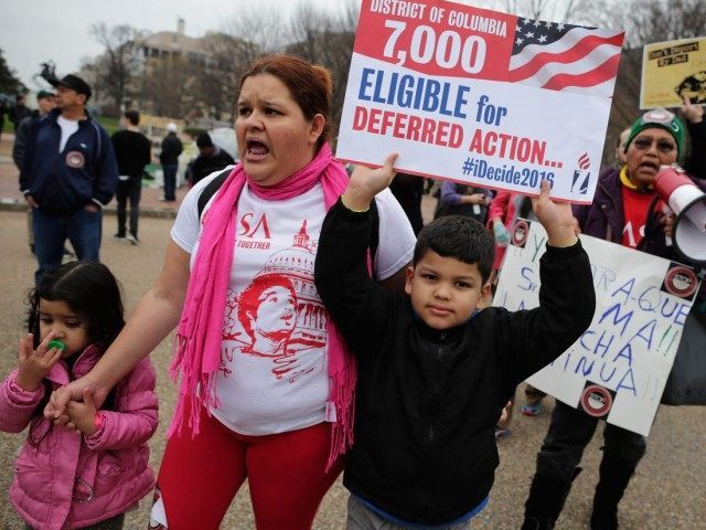 WASHINGTON, DC - DECEMBER 30: Immigrant families and their supporters rally in protest against the Obama Administration's plans to target undocumented immigrant families in a series of raids early next year in front of the White House December 30, 2015 in Washington, DC. Citing their need to flee violence in …