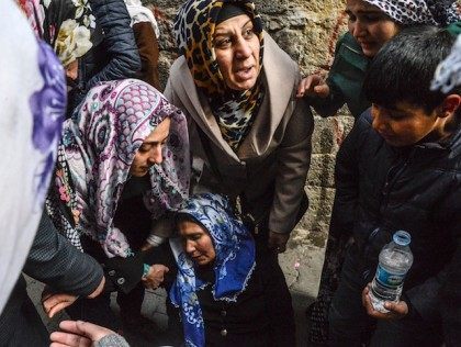 Relative cry after a woman died at her home when a mortar hit it during a clashes at Sur district in Diyarbakir, on January 3, 2016. Tensions are running high throughout Turkey's restive southeast as security forces impose curfews in several towns including Cizre in a bid to root out …