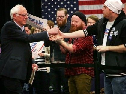 WATERLOO, IA - JANUARY 31: Democratic presidential candidate Sen. Bernie Sanders (I-VT) (L) greets supporters as he arrives at a campaign event at Five Sullivan Brothers Convention Center January 31, 2016 in Waterloo, Iowa. Sanders continues to seek support for the Democratic nomination prior to the Iowa caucus on February …
