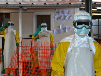 Health workers in protective gear at the Nongo ebola treatment centre Getty
