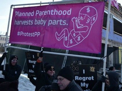 Anti-abortion activists take part in a protest outside of a Planned Parenthood center construction site on January 21, 2016 in Washington, DC. The protest comes a day ahead of the annual March for Life. / AFP / Mandel Ngan (Photo credit should read