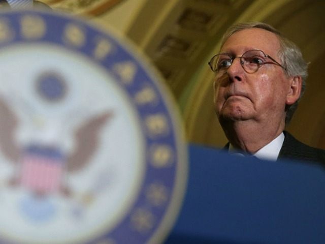 Senate Majority Leader Mitch McConnell (R-KY) listens during a media briefing after the Re