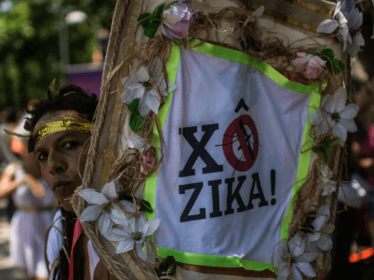 Revelers wearing Greek style costumes raise awareness of the need to prevent the spread of the Zika