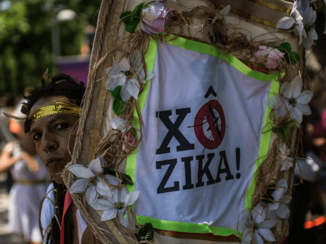Revelers wearing Greek style costumes raise awareness of the need to prevent the spread of the Zika