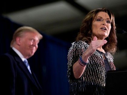 Former Alaska Gov. Sarah Palin, right, endorses Republican presidential candidate Donald Trump during a rally at the Iowa State University, Tuesday, Jan. 19, 2016, in Ames, Iowa. (AP Photo/Mary Altaffer)