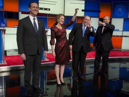 2016 Republican presidential candidates Rick Santorum, former senator, from left, Carly Fiorina, former chairman and chief executive officer of Hewlett-Packard Co., Mike Huckabee, former governor of Arkansas, and Jim Gilmore, former governor of Virginia, arrive to participate in the Republican presidential candidate debate in Des Moines, Iowa, Jan. 28, 2016.