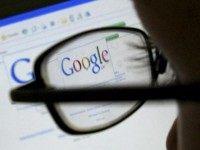 A Google search page is seen through the spectacles of a computer user in Leicester google
