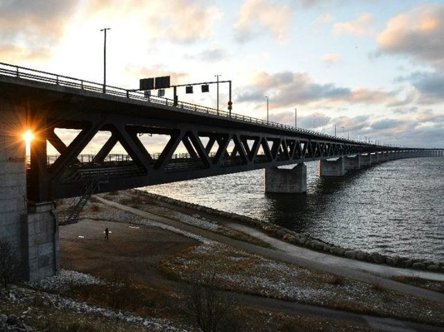 The sun sets over the Oresund Bridge between Sweden and …