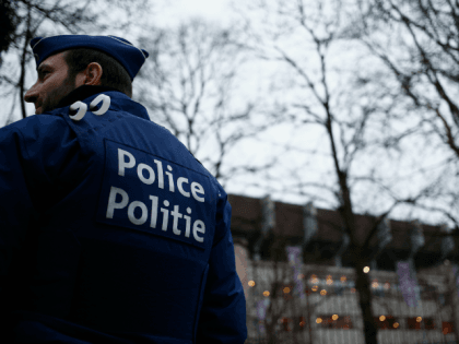 A police officer stands outside the stadium prior to the UEFA Europa League round of 32 first leg m