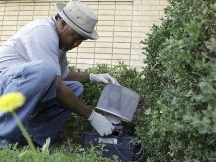 Byron Chism, a mosquito technician with Dallas County, sets a mosquito trap to capture subjects for testing in Dallas, Friday, May 11, 2007. With the arrival of spring rainstorms and steamy weather, mosquito-control workers in Texas and across the nation are gearing up for another round in their battle against …
