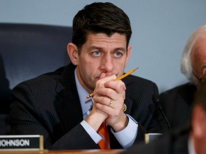 House Ways and Means Committee Chairman Paul Ryan, R-Wisc., listens as Treasury Secretary Jack Lew defends President Barack Obama's new budget proposals, on Capitol Hill in Washington, Tuesday, Feb. 3, 2015. Rep. Ryan, who agrees with Obama on extending the earned income tax credit to more workers without children, says …