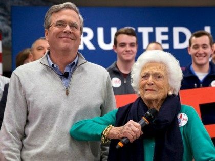 Barbara Bush, right, jokes with her son, Republican presidential candidate, former Florida Gov. Jeb Bush, while introducing him at a town hall meeting at West Running Brook Middle School in Derry, N.H., Thursday Feb. 4, 2016.