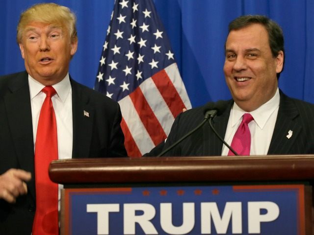 Republican presidential candidate Donald Trump stands with New Jersey Gov. Chris Christie