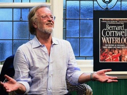 Bernard Cornwell speaks with fans as he signs books at an engagement to promote his first