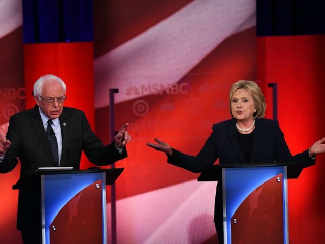 Democratic presidential candidates Hillary Clinton (R) and Bernie Sanders participate in t