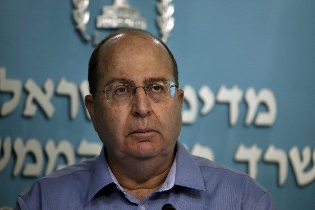 Israeli Defence Minister Moshe Yaalon pauses during a press conference at the prime minist