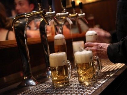 BERLIN, GERMANY - APRIL 22: A bartender serves beers at the Alt Berlin (Old Berlin) bar on April 22, 2014 in Berlin, Germany. The bar, which opened in 1893 and is known for its familial atmosphere, is claimed to be the oldest bar in the German capital, a city with …