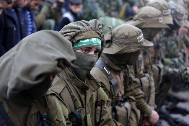 Palestinian members of the Ezzedine al-Qassam Brigades, the armed wing of the Hamas moveme