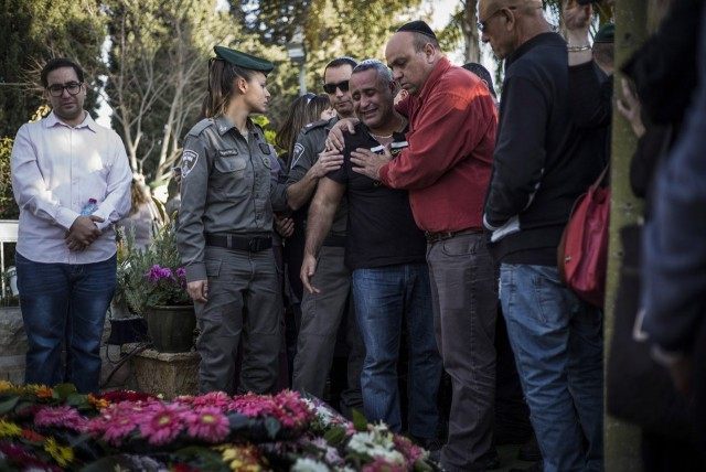 Relatives and family members seen mourning during the funeral of Hadar Cohen on February 4